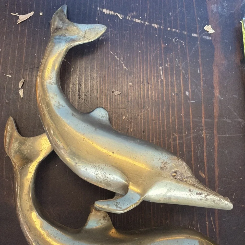 brass dolphin sculpture